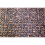 An antique rich blue ground full pile Persian Tabriz carpet with a unique floral design, park silk