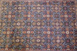 An antique rich blue ground full pile Persian Tabriz carpet with a unique floral design, park silk