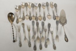 A set of twelve continental silver (800 mk) cake forks with pierced handles, and a set of twelve