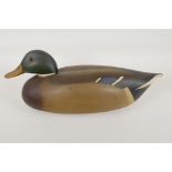 A wood decoy duck painted as a drake, signed and dated 1977, 16" long