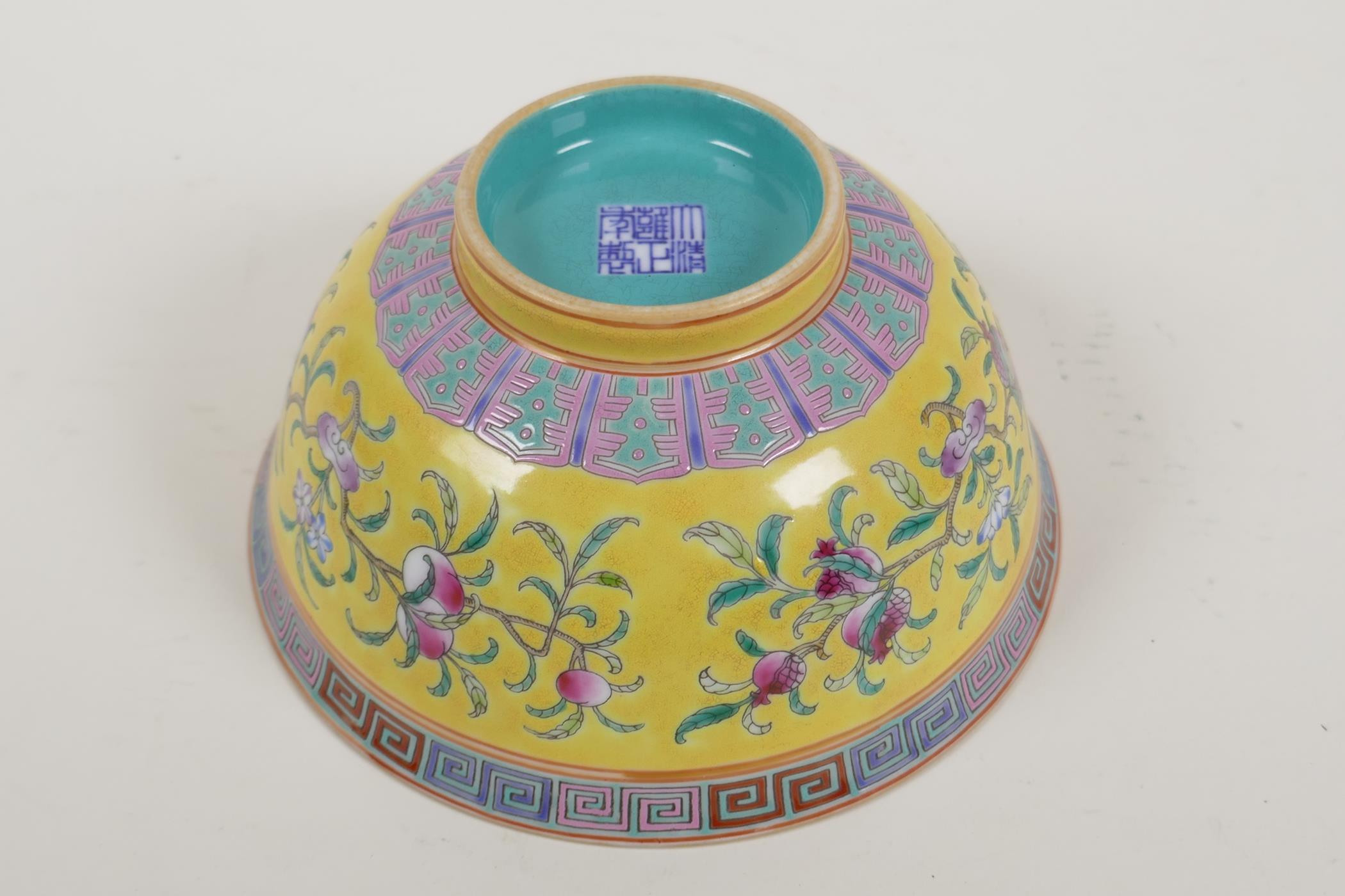 A Chinese yellow and turquoise ground porcelain rice bowl with famille rose enamelled peach tree - Image 5 of 6