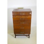A mid-century meredew lacquered mahogany five drawer chest with moulded fronts raised on tapering