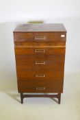 A mid-century meredew lacquered mahogany five drawer chest with moulded fronts raised on tapering