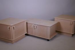 A pair of G-Plan white ash corner cupboards with two doors, 23" x 23" x 19", and a media unit, A/F