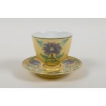 A Chinese Sancai glazed porcelain tea cup and saucer with lotus flower decoration, Kangxi 6