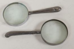 A hallmarked silver handled desk top magnifying glass, 6" long, and another similar