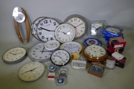 A quantity of wall clocks, battery, clockwork and main alarm clocks