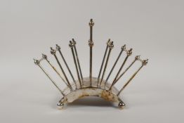 A Christopher Dresser style silver plated toast rack, 8½" wide