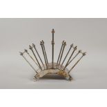 A Christopher Dresser style silver plated toast rack, 8½" wide