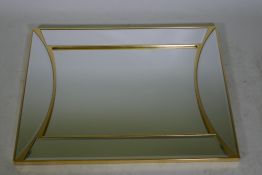 A contemporary bevelled glass wall mirror with a gilt frame, 28" x 37"