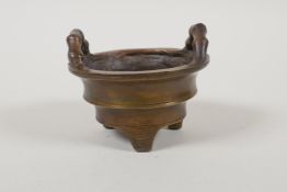 A Chinese bronze basket shaped censer with bamboo style handles, impressed 4 character mark to base,