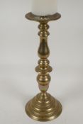 An ecclesiastical turned brass pricket candlestick, 15" high