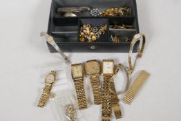 A leather jewellery box containing a lady's rolled gold bracelet watch, various lady's and