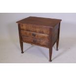 An Edwardian stained beech sheet music box/cabinet, with lift up top and two drawers, raised on