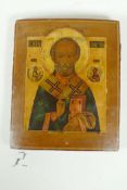 An C18th Russian Orthodox icon of Saint Nicholas, painted on a poplar panel and fitted with a silver