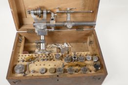 A Lorch Schmitt & Co watchmaker lathe, 9½" long, with accessories, in original box