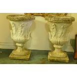 A pair of vintage concrete garden urns, with classical frieze decoration, 34" high