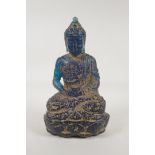 A Chinese archaic style blue composition figure of buddha with a distressed finish, 10" high