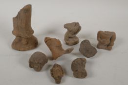 A quantity of early Indonesian pottery shards, including Buddha and animal head busts