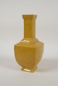 A Chinese yellow ground porcelain vase with decorative dragon panels, impressed seal mark to base,