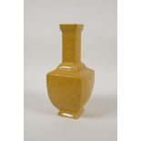 A Chinese yellow ground porcelain vase with decorative dragon panels, impressed seal mark to base,