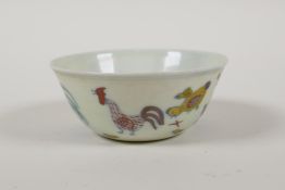 A Doucai porcelain tea bowl with chicken decoration, Chinese 6 character mark to base, 3" diameter