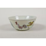 A Doucai porcelain tea bowl with chicken decoration, Chinese 6 character mark to base, 3" diameter