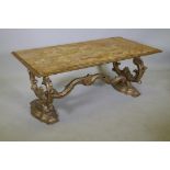 An Italian giltwood coffee table with Sienna marble top, raised on shaped and carved end supports,