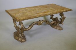 An Italian giltwood coffee table with Sienna marble top, raised on shaped and carved end supports,