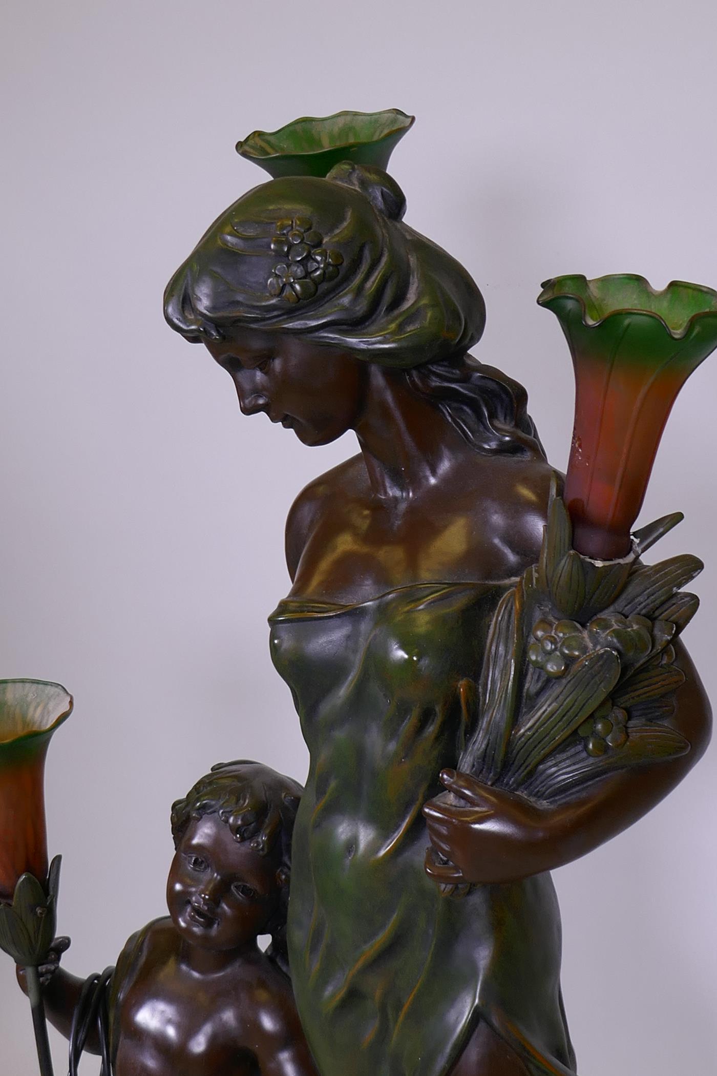 An Art Nouveau style bronzed composition three branch floor lamp in the form of maiden with child, - Image 2 of 3