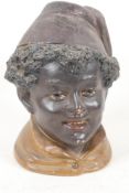A Bohemian pottery tobacco jar moulded in the form of a boy's head, 'The Magician' by Bernard Bloch,