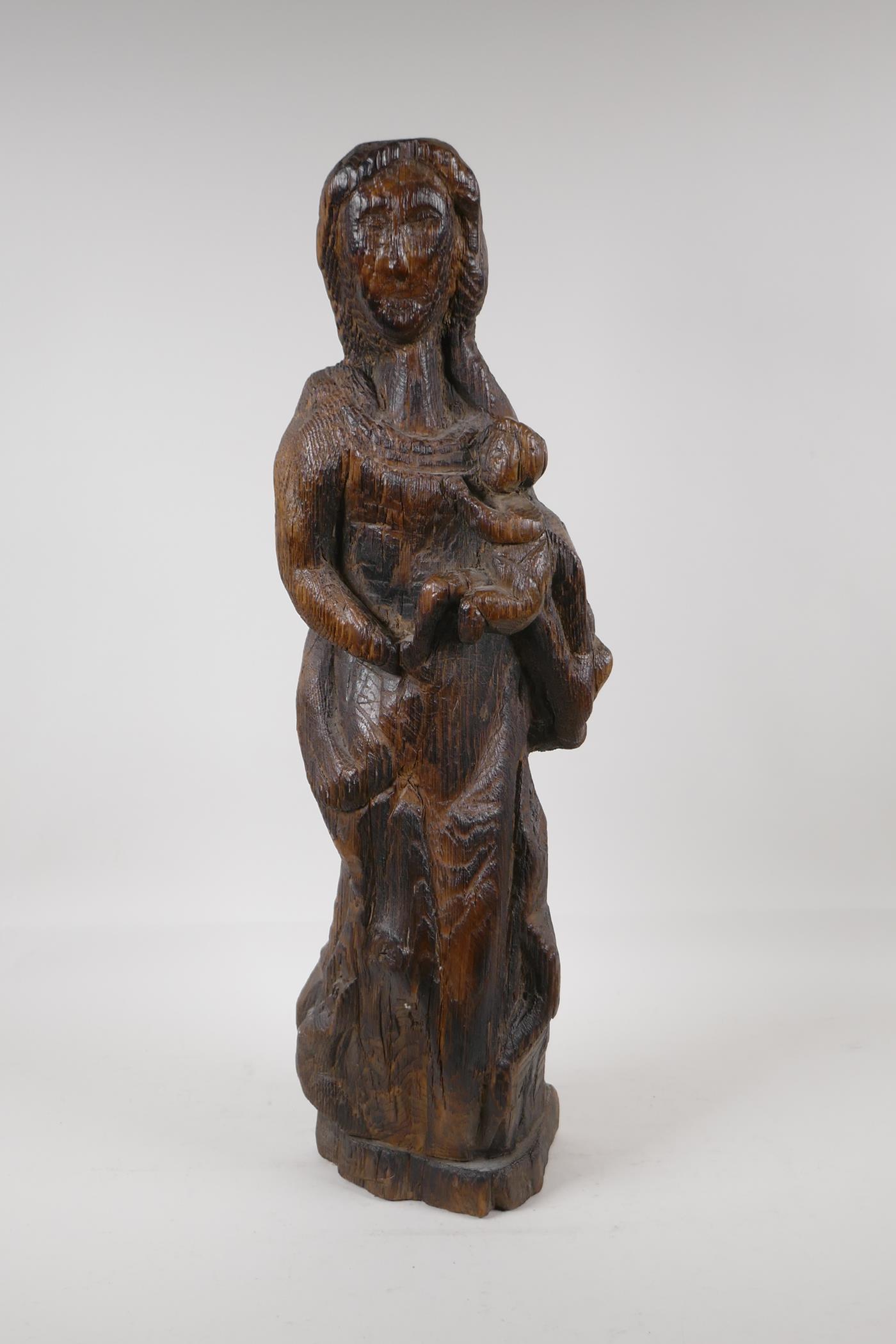 An antique oak carving of the Madonna & Child, 22" high