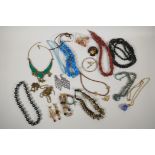A collection of assorted costume jewellery, mostly necklaces and many semi precious stones