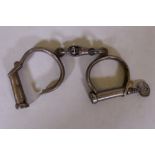 A pair of Victorian Hiatt Best No.18 police handcuffs, with key, marked 26