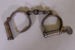 A pair of Victorian Hiatt Best No.18 police handcuffs, with key, marked 26