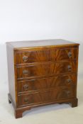 A mahogany chest of four long drawers, raised on bracket feet, 29" x 18" x 30" high