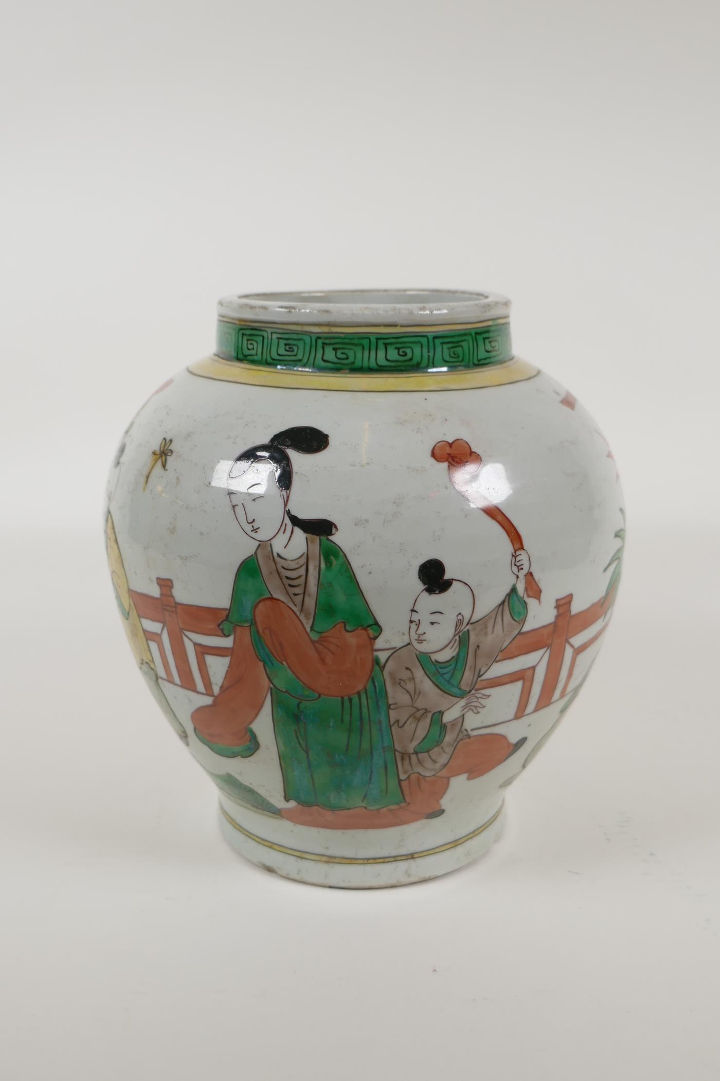 A Chinese Wucai porcelain jar decorated with women and children in a garden, 8½" high - Image 2 of 5