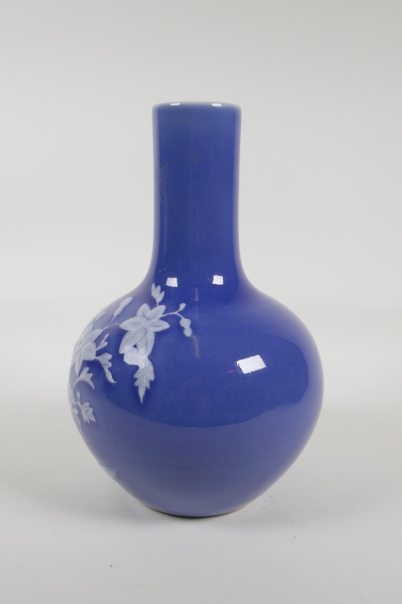 A blue glazed porcelain vase with white enamelled floral decoration, Chinese Qianlong seal mark to - Image 2 of 5