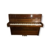 An 'Elysian' mahogany upright piano with three pedals, model M26816, 57" x 23", 43" high