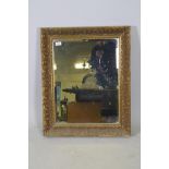 A giltwood and composition wall mirror, 24" x 30"
