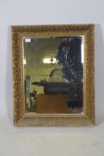 A giltwood and composition wall mirror, 24" x 30"