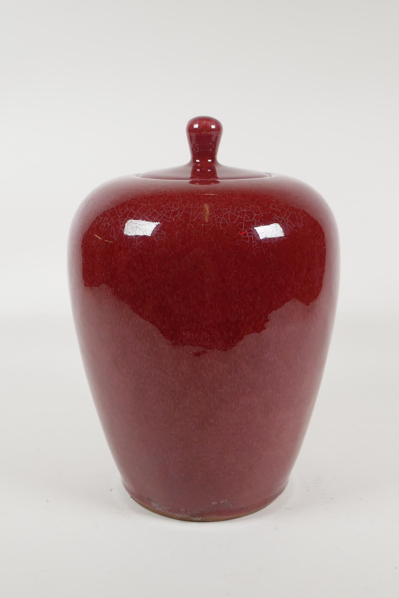 A Chinese iron red glazed porcelain jar and cover, 10½" high - Image 2 of 4