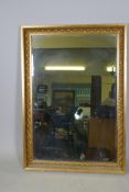 A gilt composition wall mirror, 29" x 41"