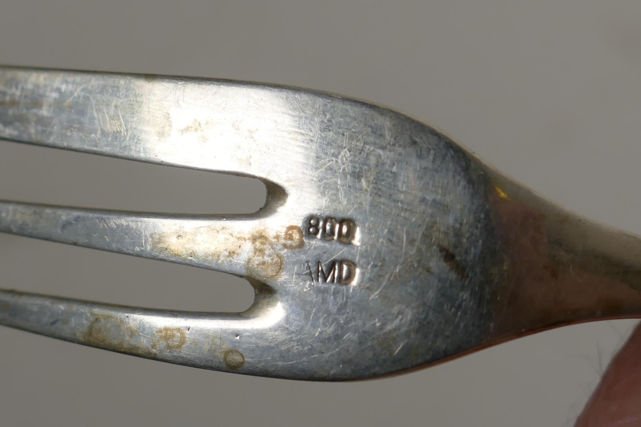 A set of twelve continental silver (800 mk) cake forks with pierced handles, and a set of twelve - Image 4 of 5