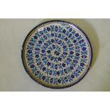 Antique middle Eastern glazed terracotta charger with Iznik style decoration, A/F, 18" diameter