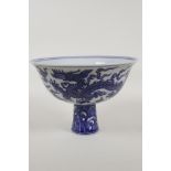 A Chinese blue and white porcelain stem bowl decorated with two dragons, 6 character mark to the