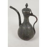 An Omani silver on copper coffee pot, 13½" high
