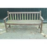A painted weathered teak garden bench, 62" long