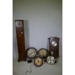 A collection of clocks, including a postman's clock and various clocks, all spring or chain