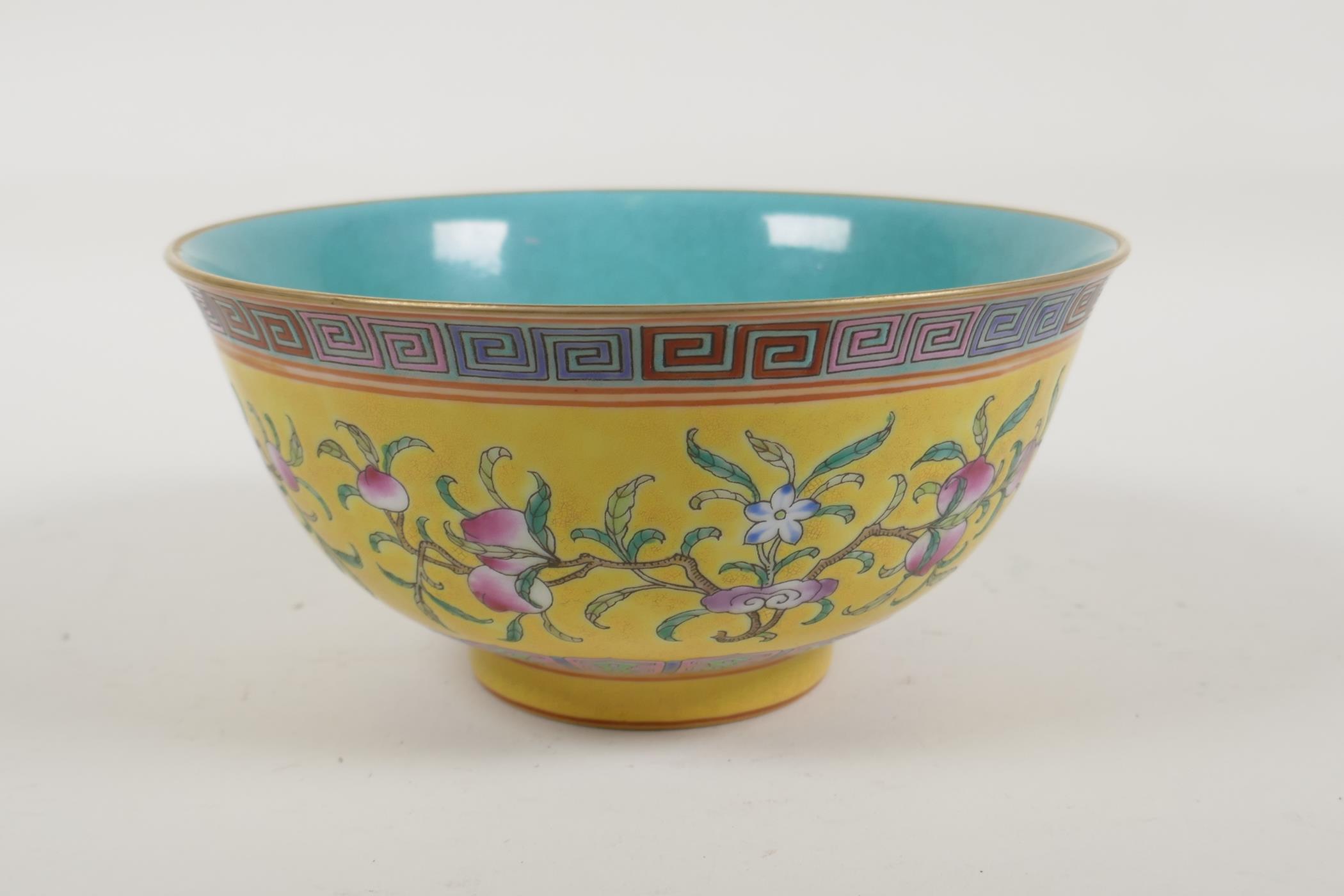 A Chinese yellow and turquoise ground porcelain rice bowl with famille rose enamelled peach tree - Image 3 of 6